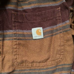 Carharrt patterned flannel. Size Medium. Had purple and tan colored stripes.